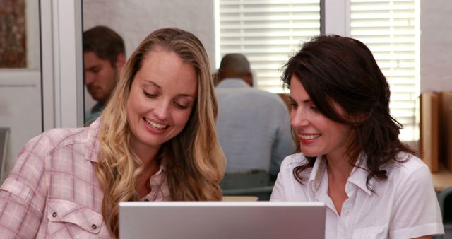 Women Collaborating on Laptop in Office Meeting Room - Download Free Stock Images Pikwizard.com