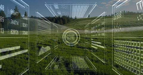 Futuristic digital interface overlay on green rural landscape