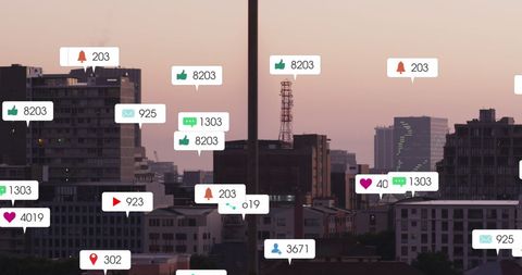 Social Media Notifications Over Urban Cityscape at Dusk