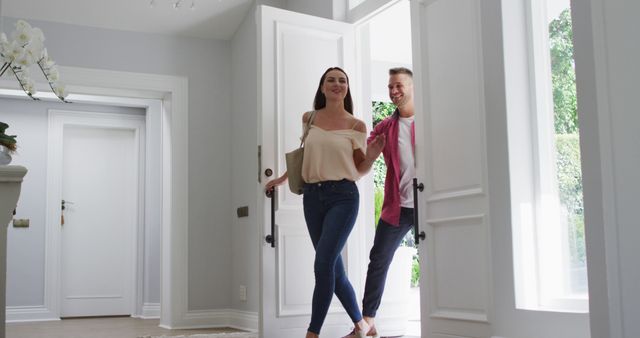 Excited caucasian son and daughter at home running to greet parents coming through the front door. happy family, domestic life at home.