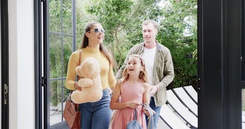 Happy family returning home after vacation