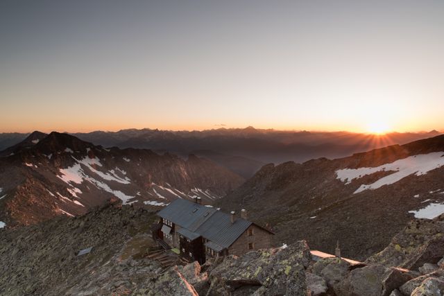 Mountain Cabin at Sunrise with Scenic Peaks and Snow - Download Free Stock Photos Pikwizard.com