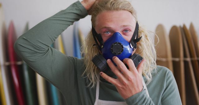 Man Wearing Respirator Mask in Surfboard Workshop - Download Free Stock Images Pikwizard.com