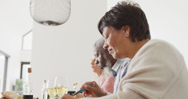 Older Friends Enjoying Meal Together at Home - Download Free Stock Images Pikwizard.com