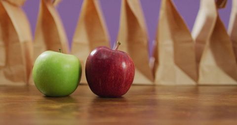 Fresh Apples and Paper Bags on Wooden Table - Download Free Stock Images Pikwizard.com