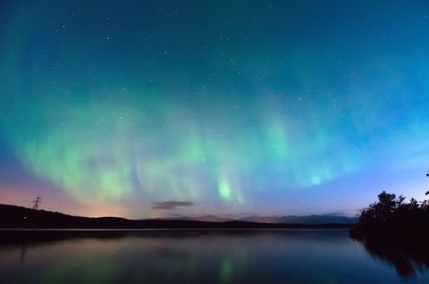 Aurora Borealis Over Tranquil Lake at Night