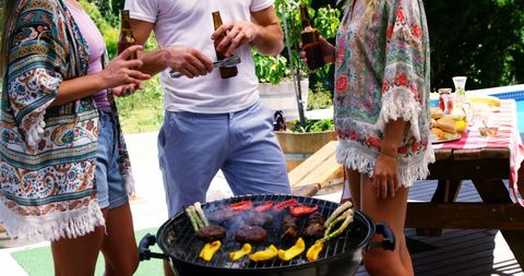 Friends Grilling and Enjoying Beer Outdoors in Summer - Download Free Stock Images Pikwizard.com