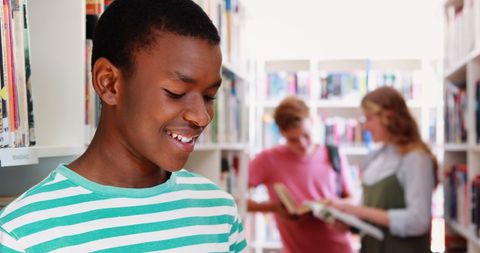 African American Teenage Boy Smiling in Library - Download Free Stock Images Pikwizard.com