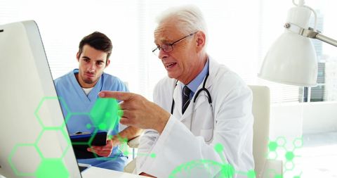 Doctors analyzing data with futuristic medical technology