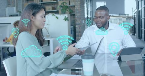 Diverse Colleagues Collaborating in Modern Office with Digital Graphics