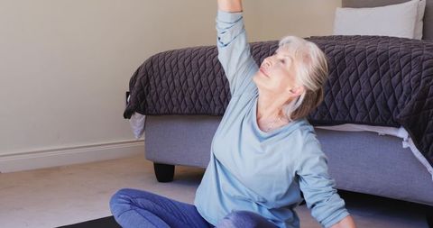 Senior Woman Practicing Yoga at Home in Comfortable Setting