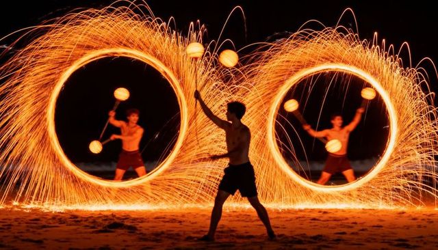 Spinning Steel Wool Fire Rings on Night Beach with Shirtless Performer Creating Sparks