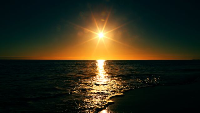 Serene Ocean Sunset with Golden Sunlight Reflection on Water - Download Free Stock Photos Pikwizard.com