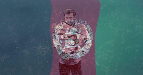 Male holding maroon flag with white emblem, digital network overlay portrait conveying unity