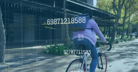 Urban cyclist riding purple hoodie with red-rim road bike and hud data overlay