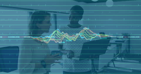 Diverse Professionals Discussing Digital Financial Data in Modern Office