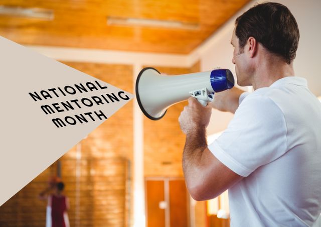 Man promoting National Mentoring Month with a megaphone in an indoor space. Ideal for educational campaigns, mentoring programs, youth support initiatives, and awareness events.