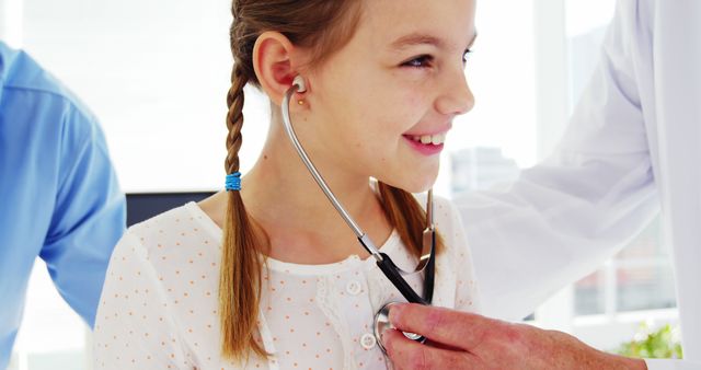 Female Doctor Using Stethoscope to Check Young Girl's Heartbeat During Routine Checkup - Download Free Stock Images Pikwizard.com