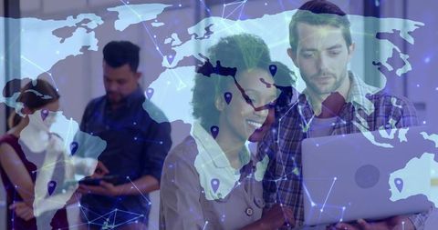 Team collaborating on laptop with world map network overlay showing global connectivity