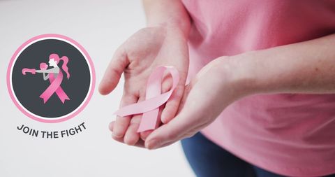 Breast cancer awareness: woman holding pink ribbon
