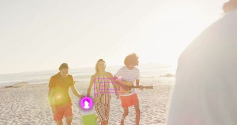 Friends Enjoying Beach Walk at Sunset with Guitar and Board