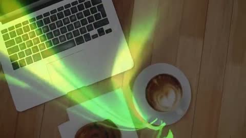 Serene Workspace with Coffee and Pastry by Silver Laptop