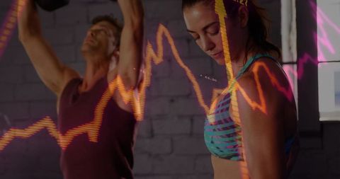 Fitness Couple Stretching with Neon Line-Chart Overlay Showing Performance Metrics