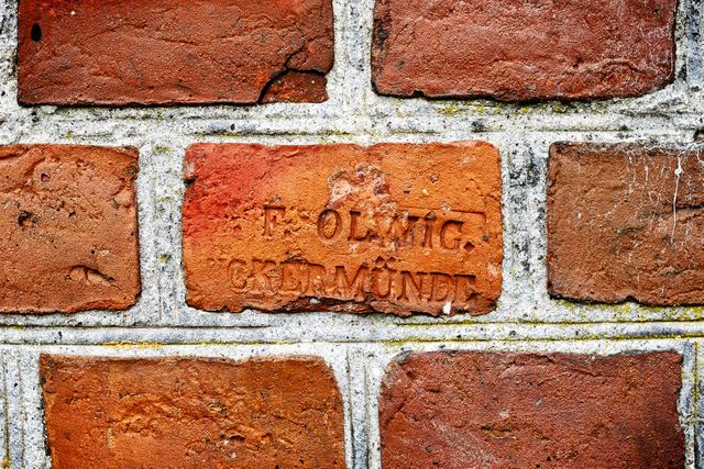 Old Brick Wall with Engraved Text - Download Free Stock Photos Pikwizard.com