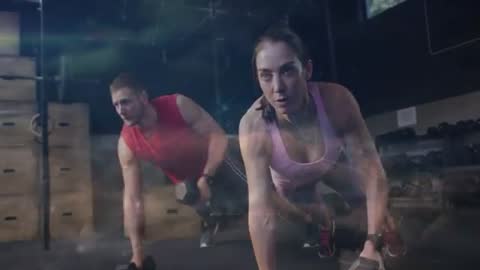 Performing Dumbbell Plank Rows Partner Workout for Core Strength and Stability