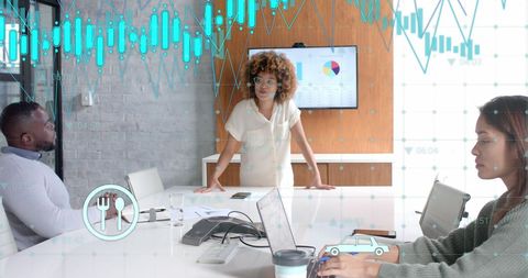 Diverse Team Analyzing Digital Data at Modern Office Meeting