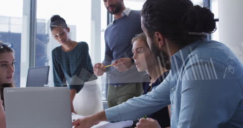 Diverse Team Analyzing Financial Data in a Modern Office