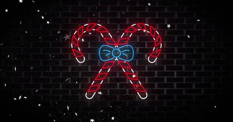 Neon Candy Canes with Bow on Dark Background