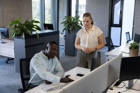 Teamwork Enhancement in Modern Open-Plan Office with Green Plants