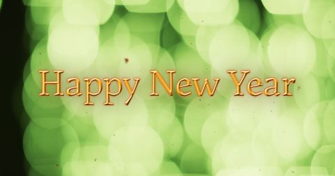 Happy New Year Text with Green Bokeh Lights Background