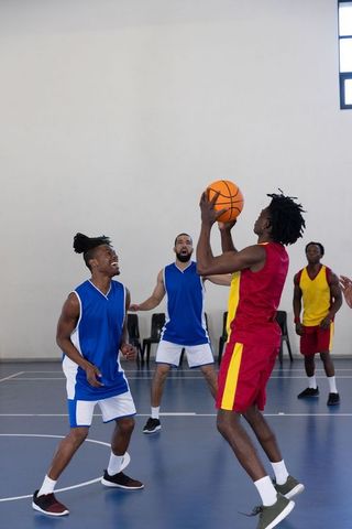 Dynamic Basketball Game Neck and Neck on Indoor Court