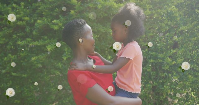 Mother Hugging Daughter Outdoors with Flowers - Download Free Stock Images Pikwizard.com