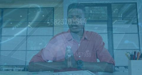 African american businessman engaged in financial data overlay call