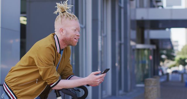 Stylish Man with Albinism Standing Outdoors with Smartphone, Urban Street View - Download Free Stock Images Pikwizard.com