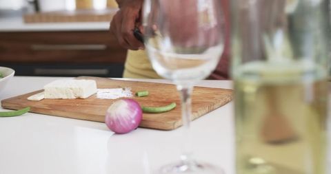 Senior African American Preparing Vegetables in Kitchen