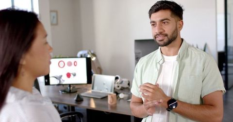 Two Colleagues Discussing Robotics Project in Modern Office