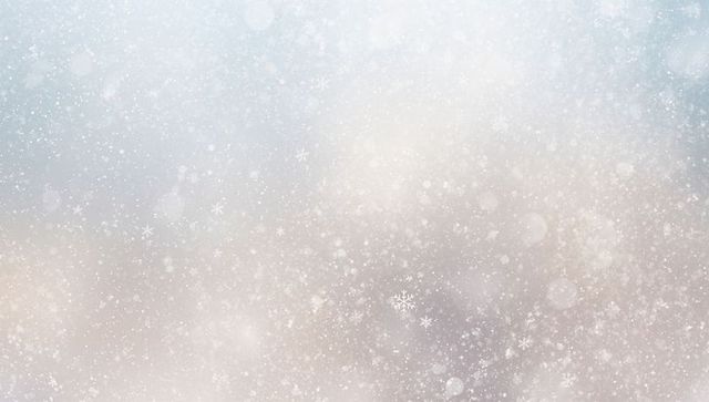 Soft falling snow with glowing bokeh and delicate crystals across winter pastel gradient