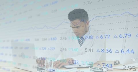 Doctor analyzing data on laptop in medical office