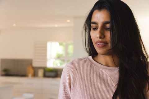 Relaxed Woman in Cozy Minimalist Kitchen Ambiance