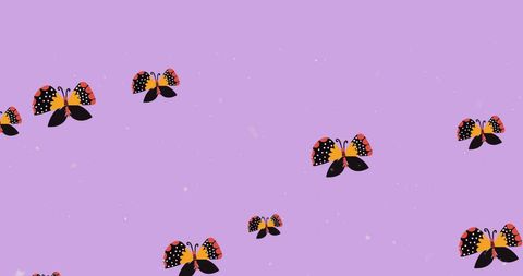 Vibrant butterflies in flight on purple background