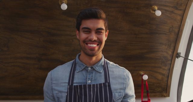 Smiling Barista Wearing Apron in Coffee Truck - Download Free Stock Images Pikwizard.com