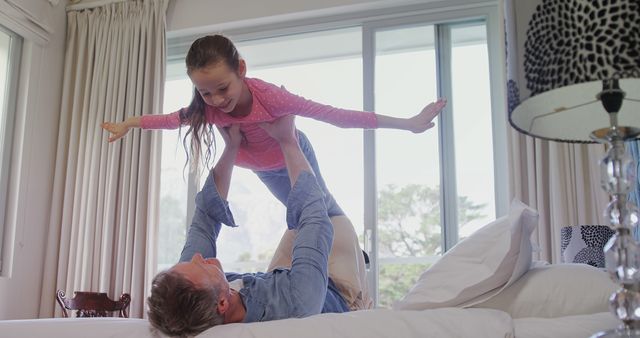 Father Playing with Daughter in Bright Bedroom - Download Free Stock Images Pikwizard.com