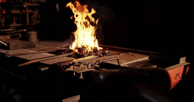 Iron rod being heated in fire at workshop 4k