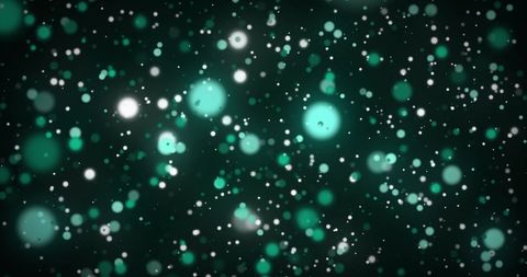 Glowing green dots in motion creating hypnotic visual