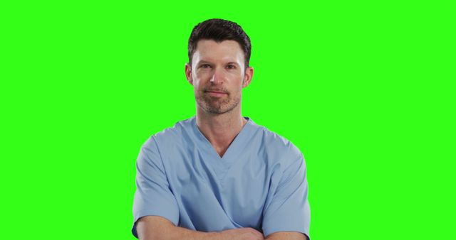 Male Medical Professional Standing with Crossed Arms on Green Screen - Download Free Stock Images Pikwizard.com