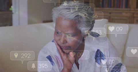 Senior woman pondering digital interaction at home